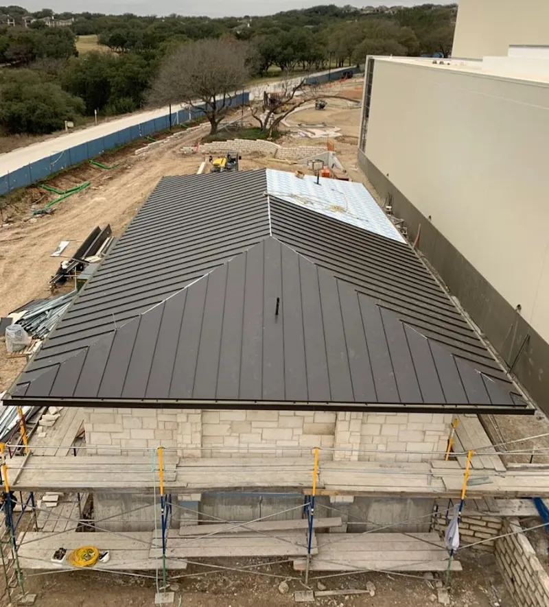 Metal roof new construction with scaffolding in Glenview